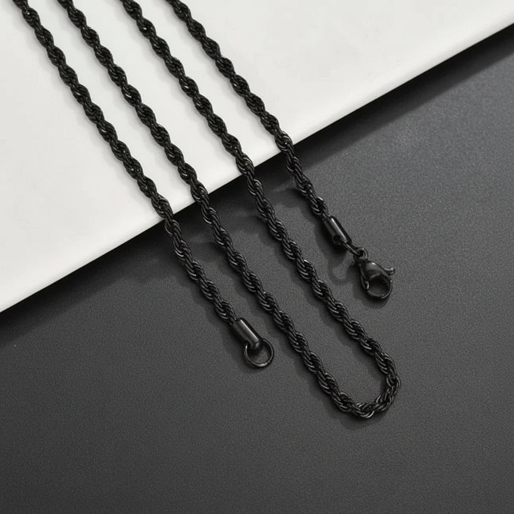 A person with a beard and neck tattoos wearing a stainless steel twisted rope necklace.