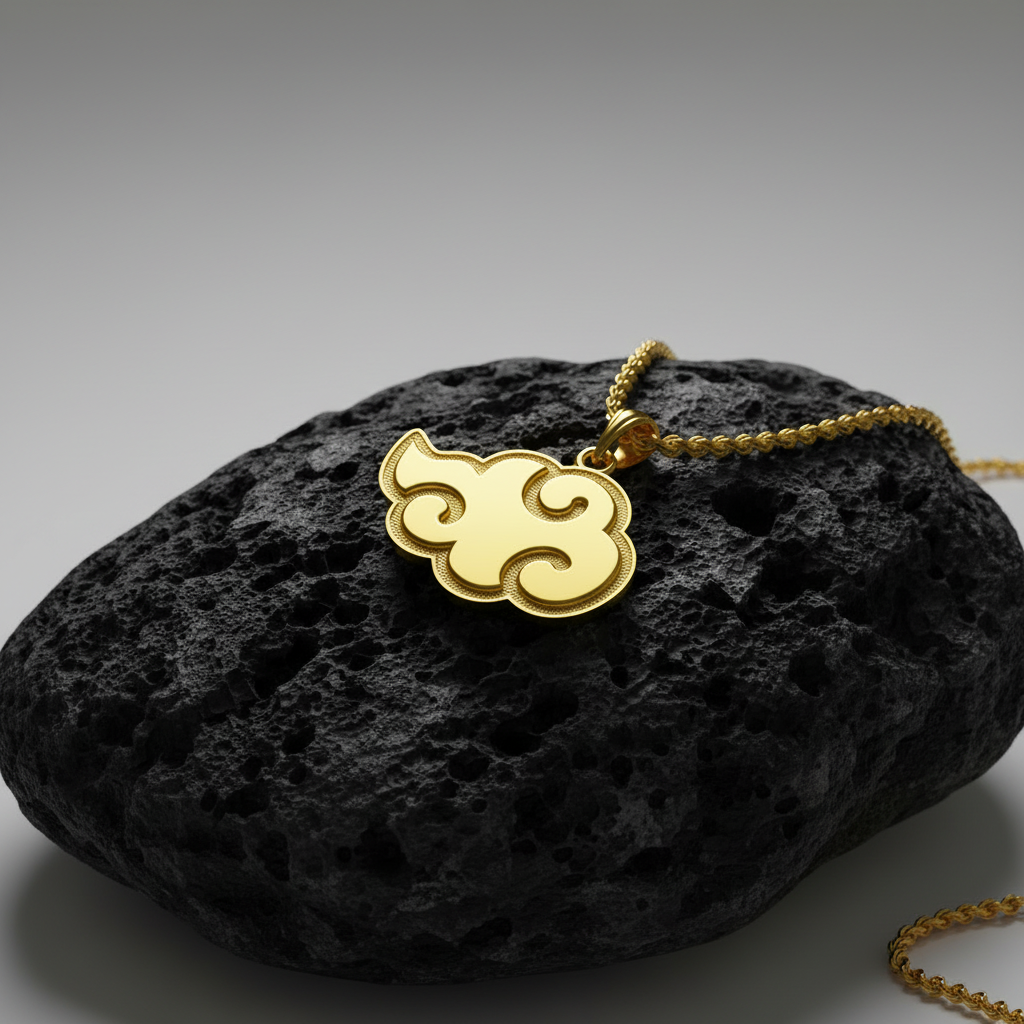 Gold cloud-shaped pendant on a chain against a white background