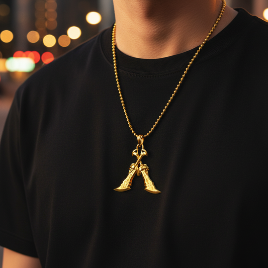 A 14K gold pendant in the shape of two crossed blades with a mountainous background.