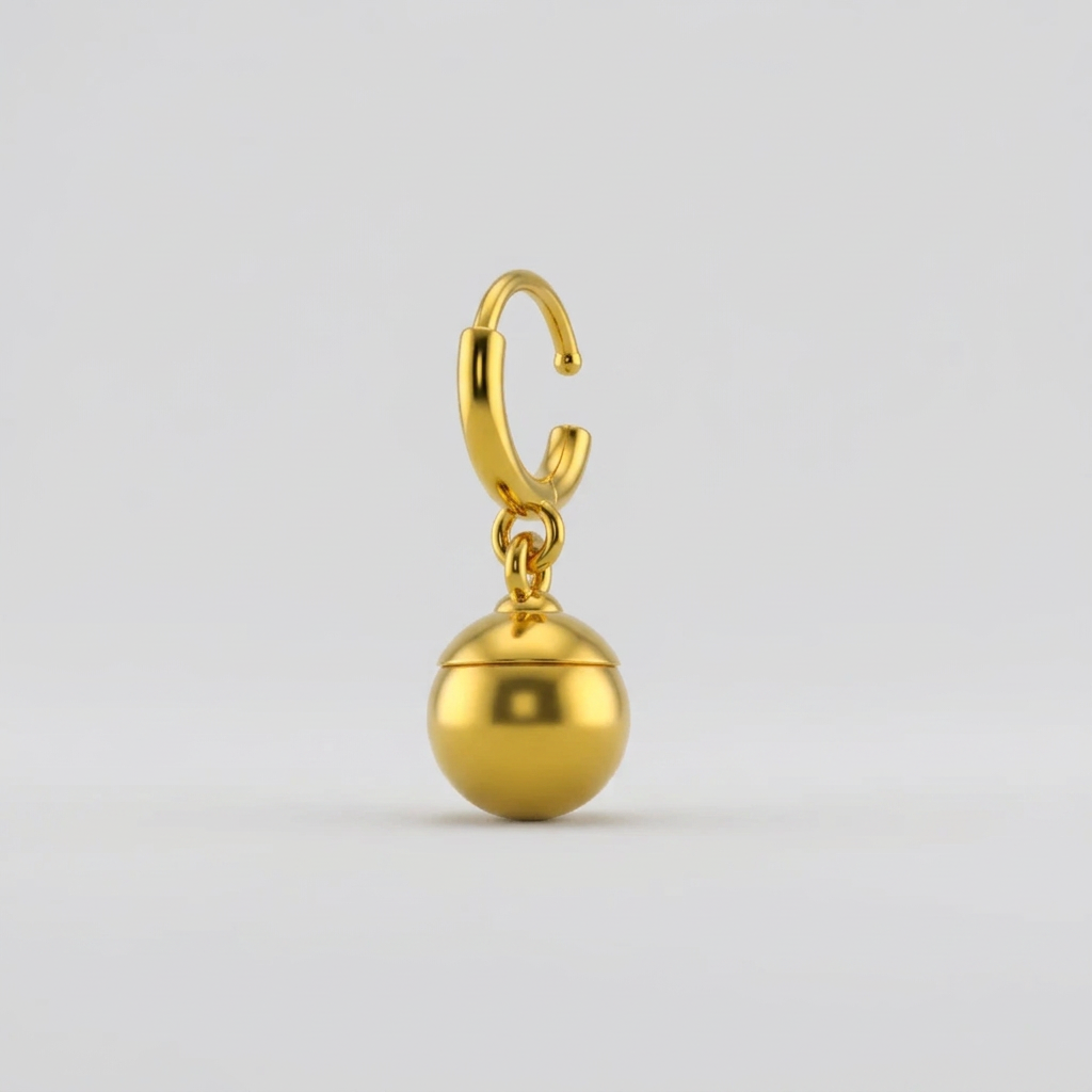 Gold hoop earring with spherical pendant on white background