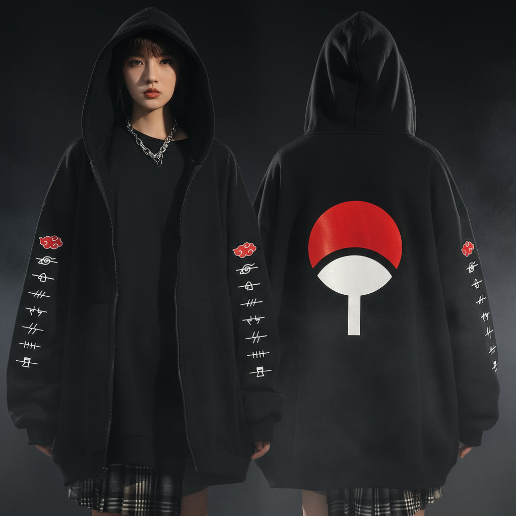An oversized black hoodie with various anime character motifs on the sleeves and front, worn by a person in a natural pose.