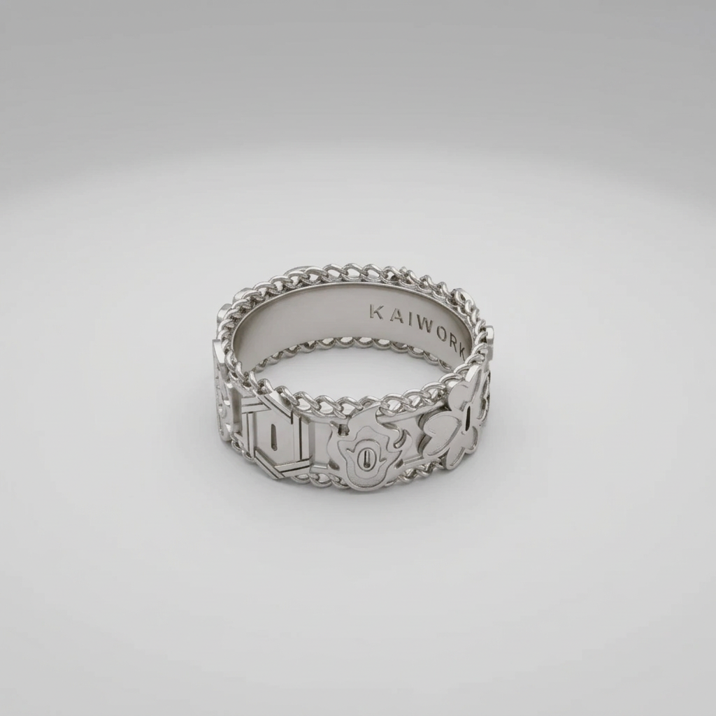 Silver ring with intricate designs on a light gray background