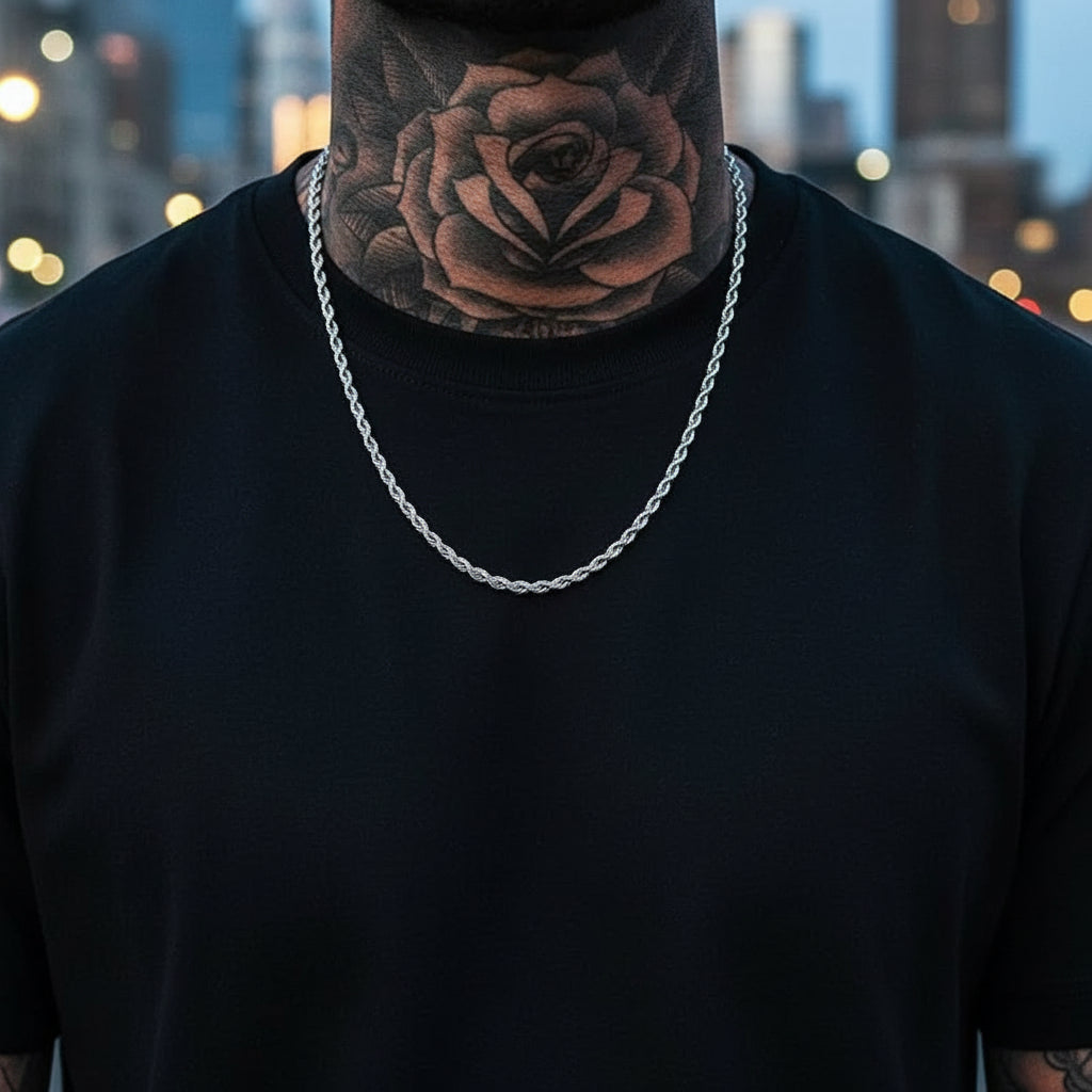 Man with a large neck tattoo of a rose and various other tattoos on his chest and shoulders.