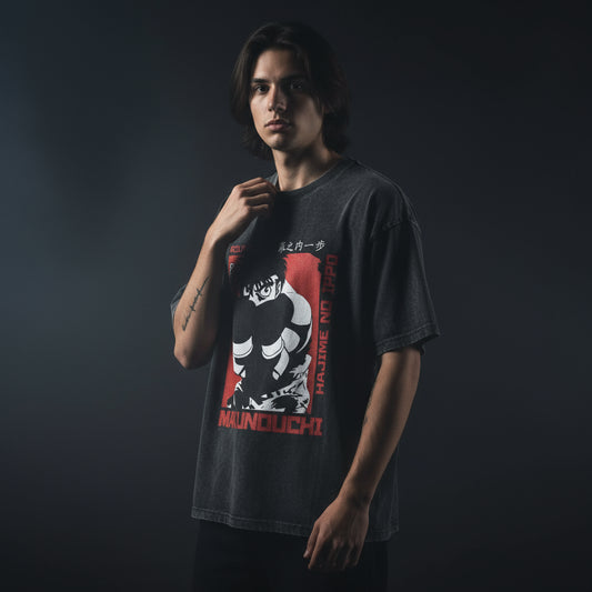 Black t-shirt with graphic design featuring a character and text on a white background