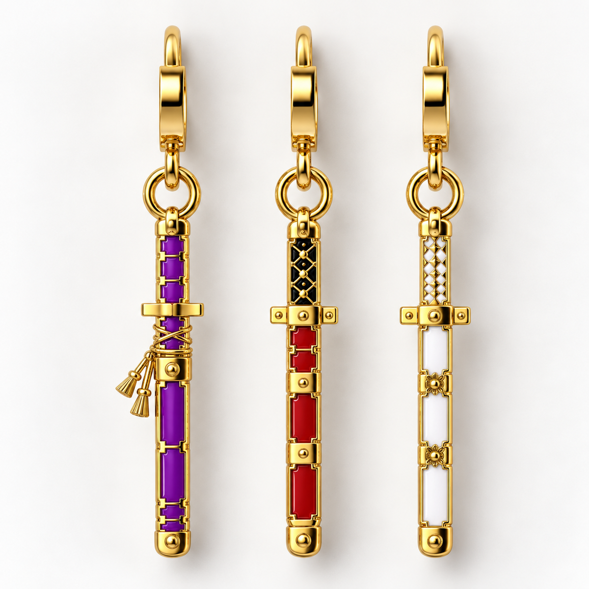 Three gold-tone sword charms with colorful accents are displayed vertically on a clean white background. The left charm features purple and gold, the middle charm features red and black, and the right charm features white and gold.