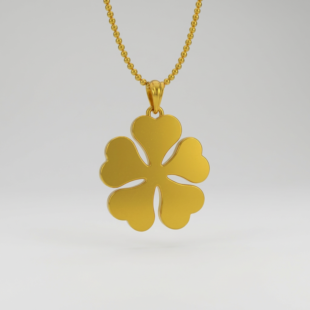 Gold four-leaf clover pendant on a white background