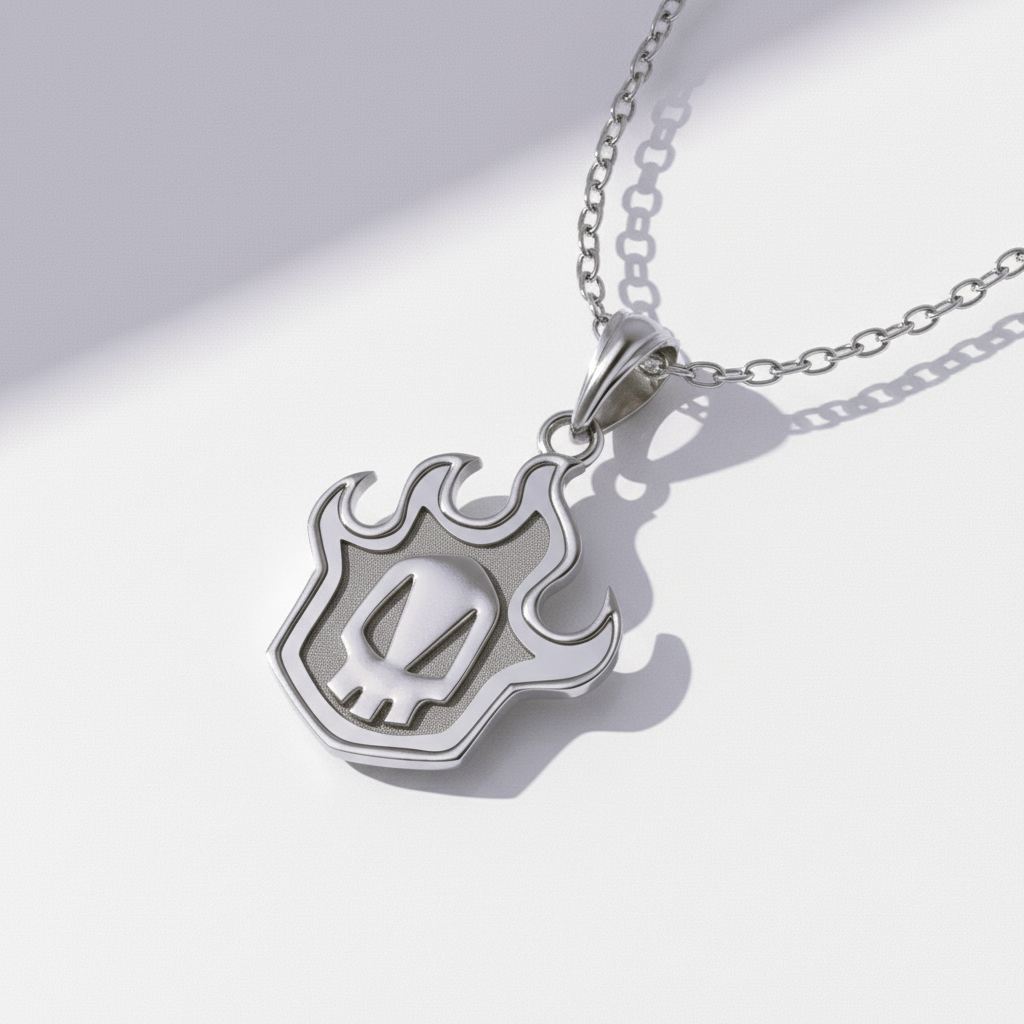 Silver necklace with a flame-shaped pendant on a white background