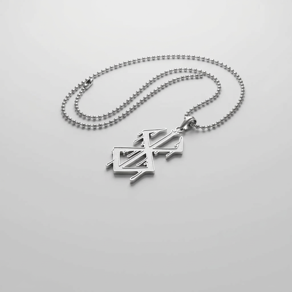 Silver necklace with a unique pendant on a dark, textured surface with smoke effect.