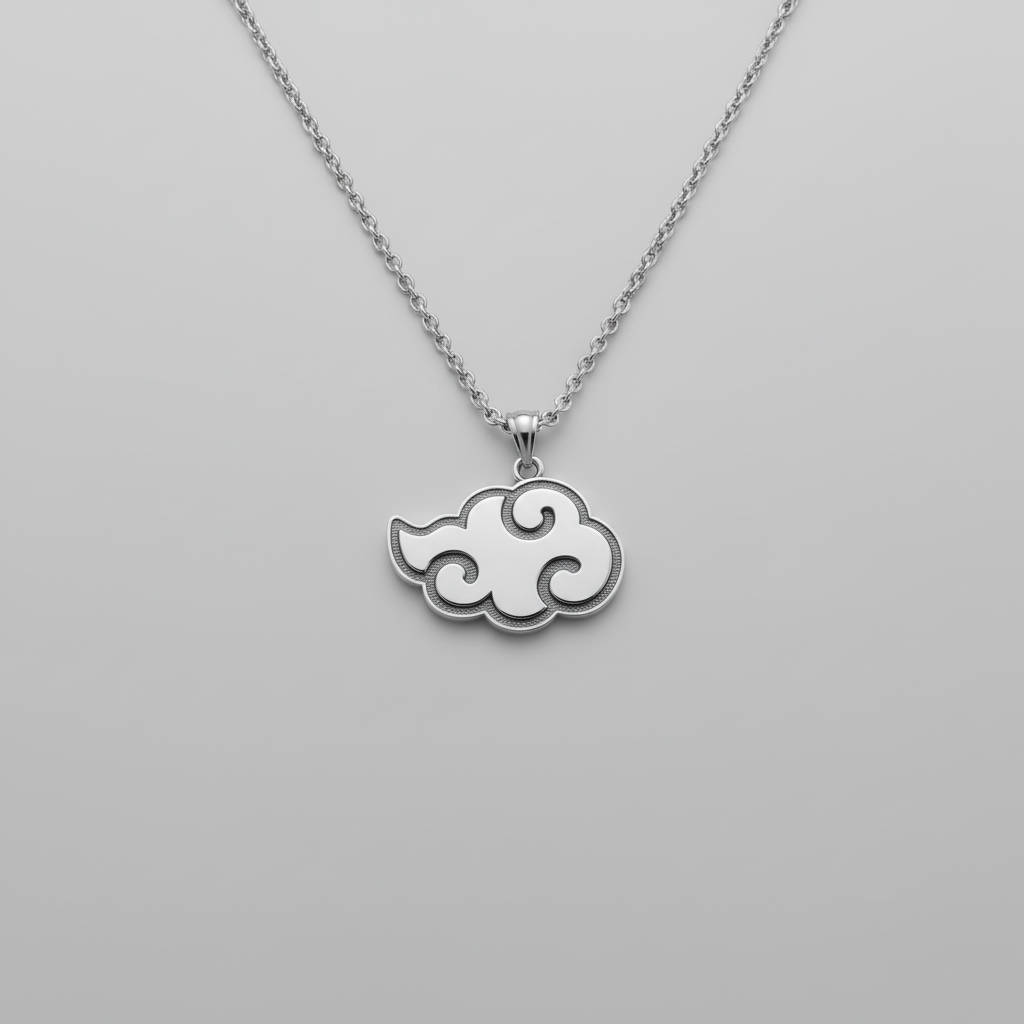 Cloud-shaped pendant on a chain resting on a dark stone surface with smoke effect.