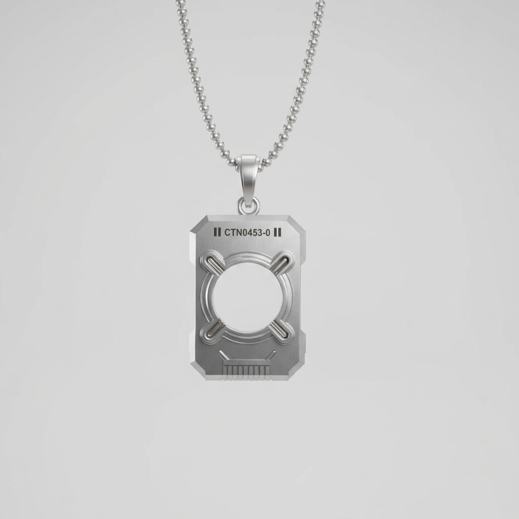 A silver pendant with a three-dimensional design resembling a data chip, held by a hand wearing a space suit, against the backdrop of a futuristic spacecraft interior.