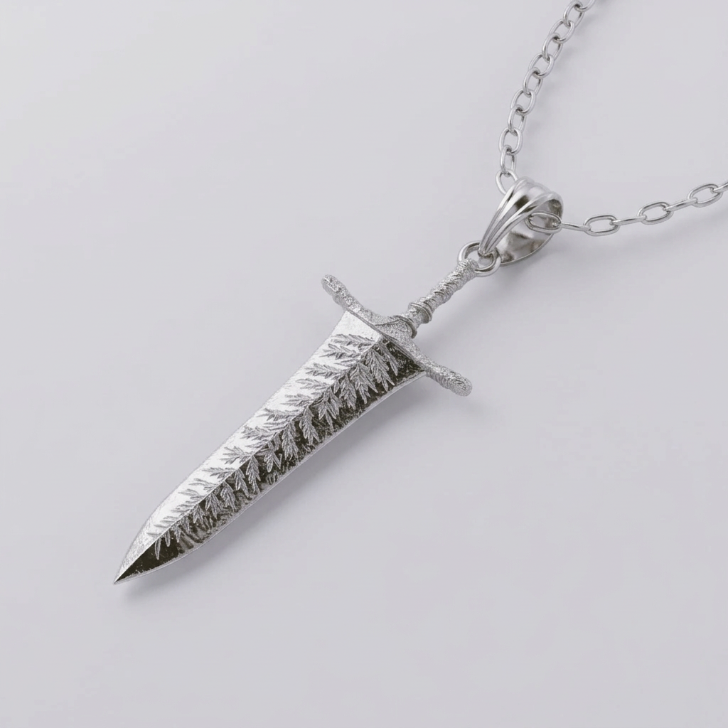 Silver dagger-shaped pendant on a chain against a light background