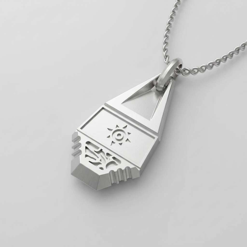 Silver pendant with intricate design on a chain against a light gray background