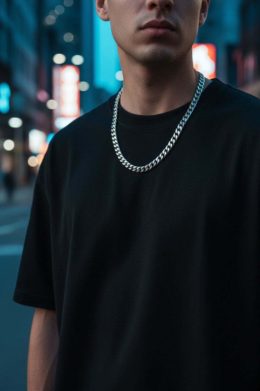 Set of silver chain necklaces with labeled widths on a dark textured background