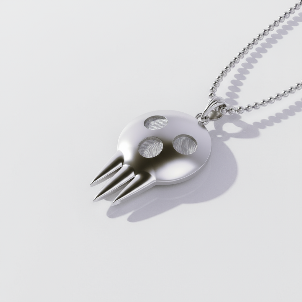 Metallic pendant shaped like a stylized face with a fork-like design on a white background