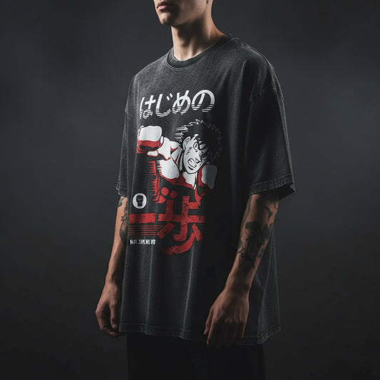 A black vintage T-shirt featuring a graphic of an anime character and text related to the anime series.