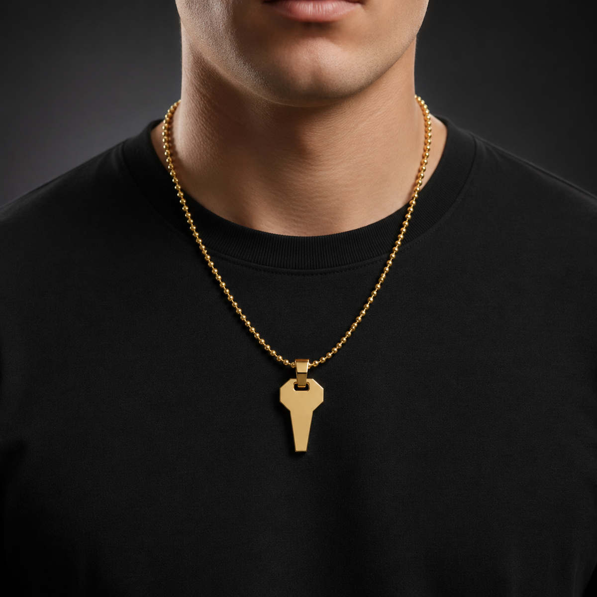 David Martinez Pendant in 14K Gold worn by a man in a dark t-shirt, showcasing elegance and style.