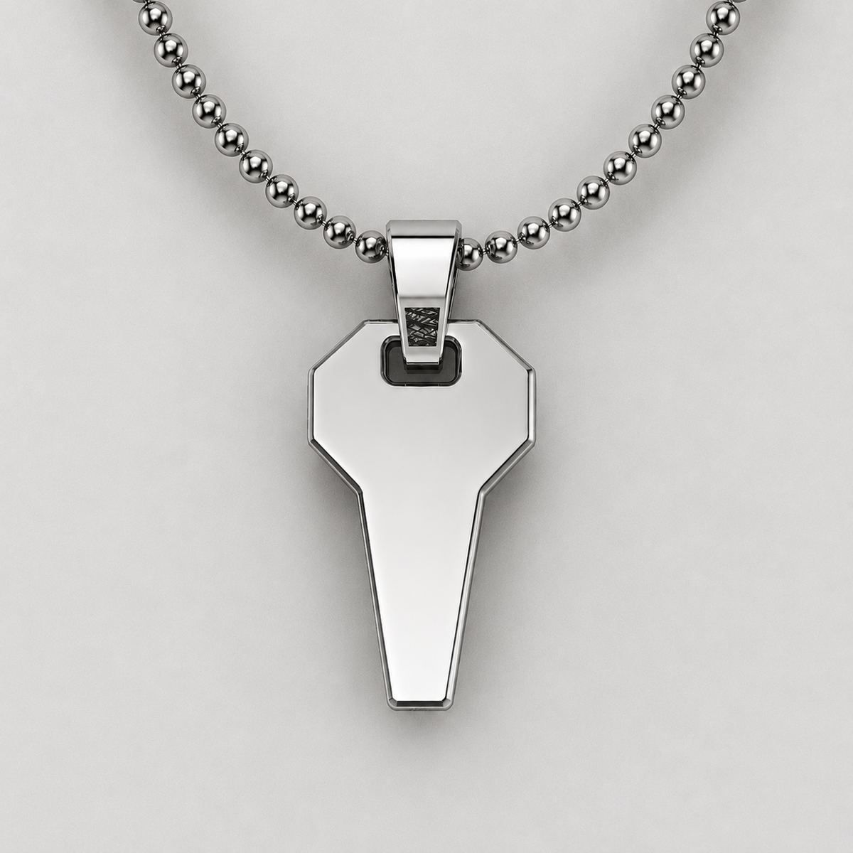 Silver pendant necklace on a light gray background