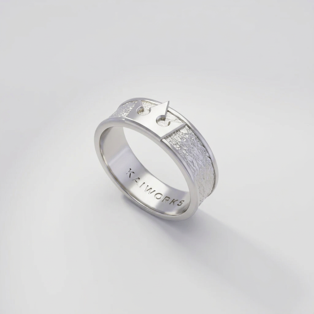 Silver ring with textured design on a light gray background