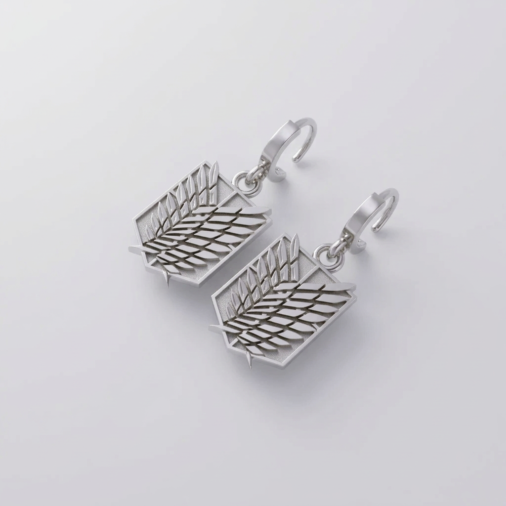 A pair of 14K gold earrings featuring a winged design, set against a dark textured background.