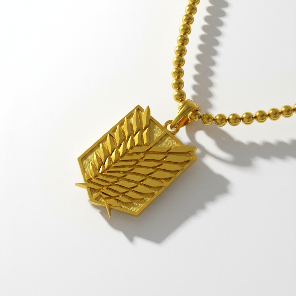 Gold necklace with a leaf pendant on a white background