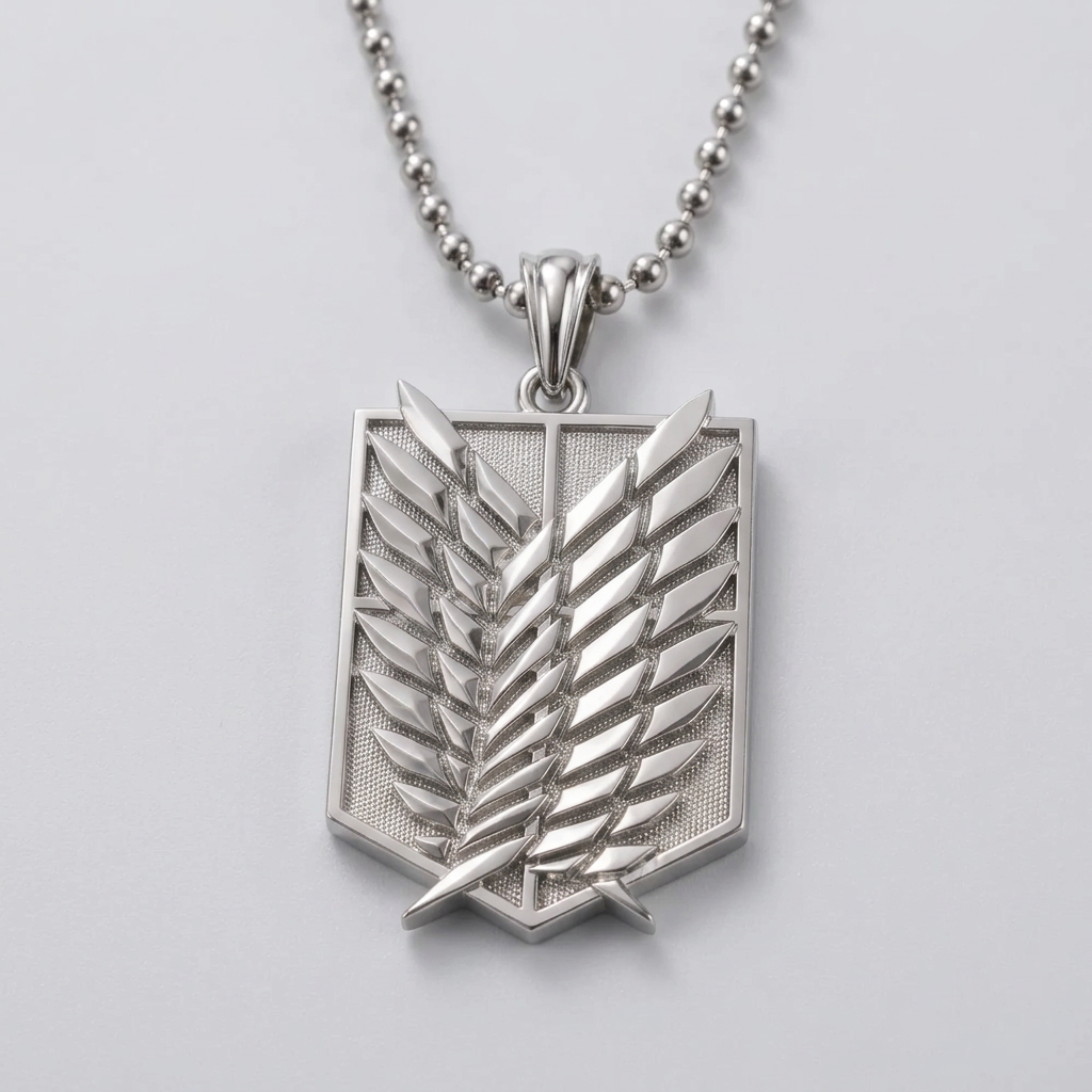 Silver pendant with a leaf design on a black stone surface