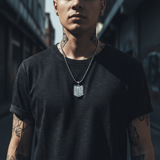 Person wearing a black t-shirt with a necklace, standing in an urban setting.
