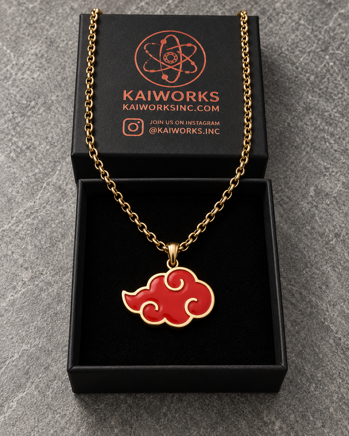 Shinobi Cloud Limited Edition pendant in a box with a gold chain and red enamel cloud design.