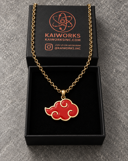 Shinobi Cloud Limited Edition pendant in a box with a gold chain and red enamel cloud design.