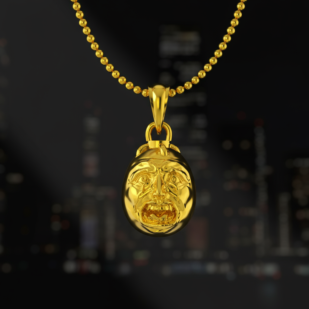 Gold pendant necklace with a face design on a dark background