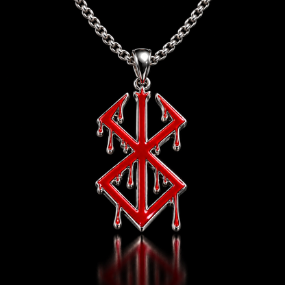 A silver pendant with a red enamel runic symbol featuring dripping details, displayed on a rustic wooden surface.