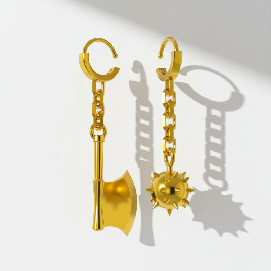 A pair of 14K gold earrings, one designed as a flail and the other as an axe, with a chain connecting each to a hoop for pierced ears, displayed against a textured grey background.