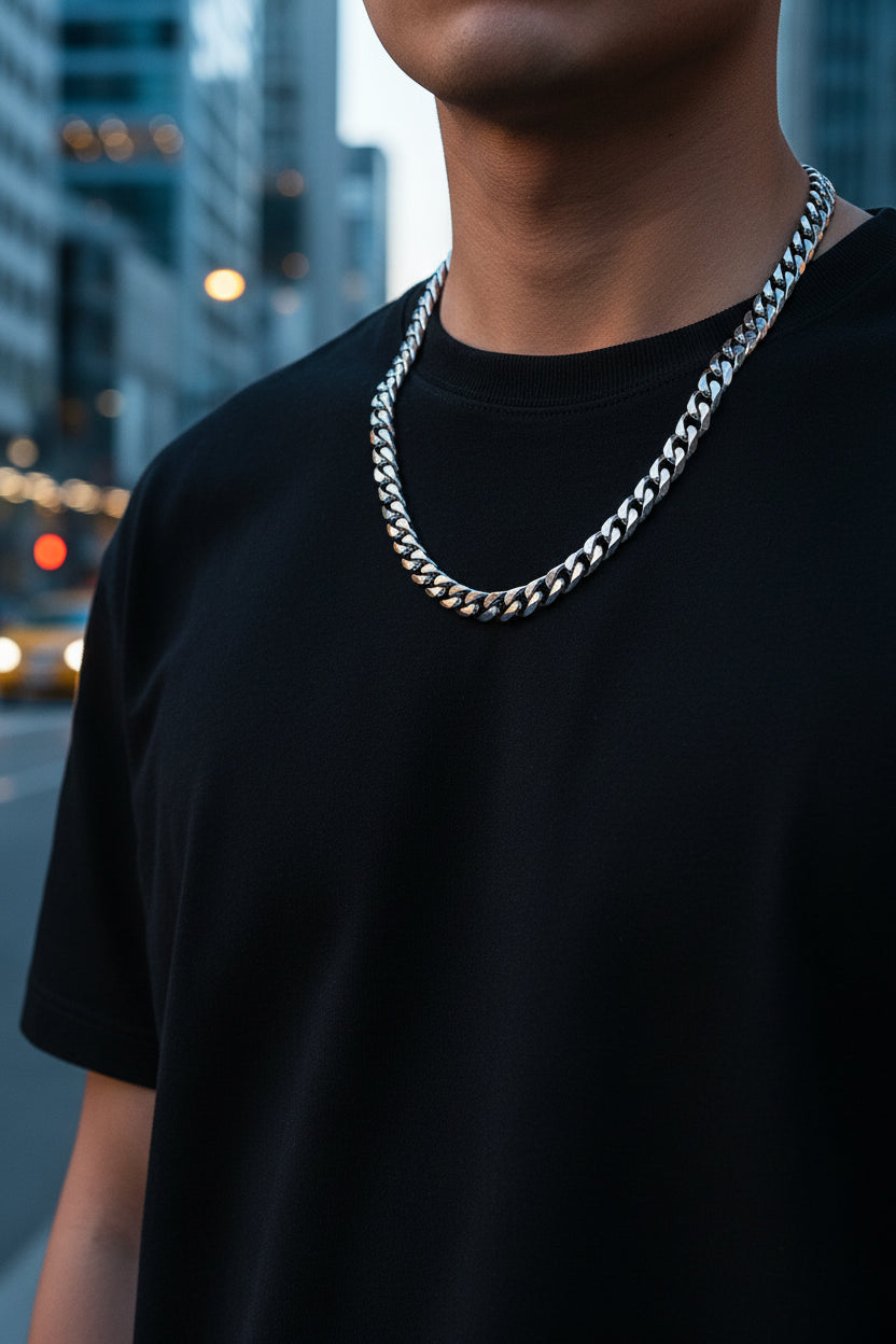 Set of silver chain necklaces with labeled widths on a dark textured background