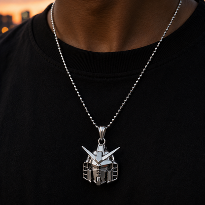 Silver pendant necklace on a black shirt with a blurred cityscape background