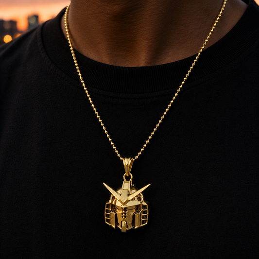 Gold robot head pendant necklace on a black shirt with a blurred cityscape background