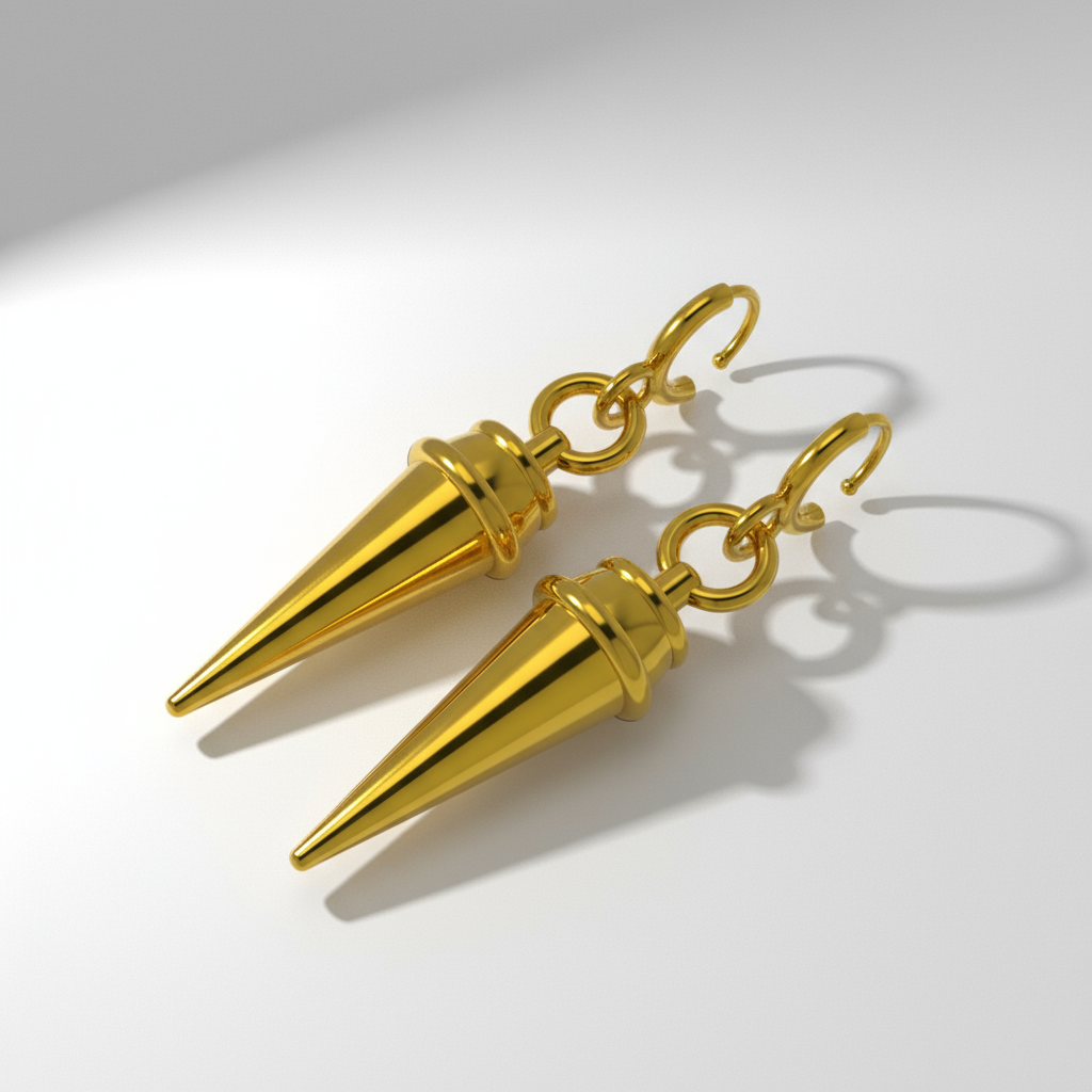 Gold spike earrings on a white background