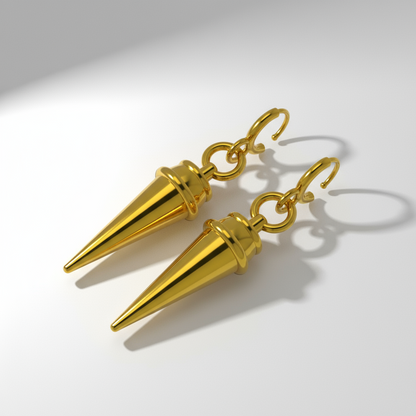 Gold spike earrings on a white background