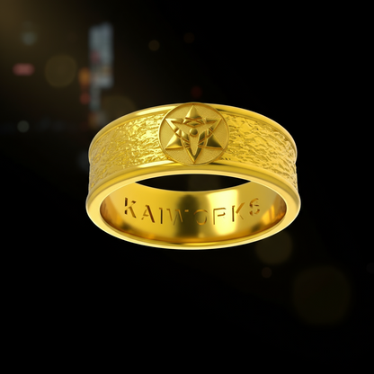 Gold ring with intricate design and 'KAWORKS' branding on a white background