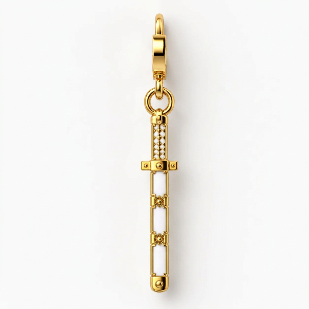A gold-plated sword charm with white enamel inlay and small clear rhinestone accents, shown vertically on a clean white background.