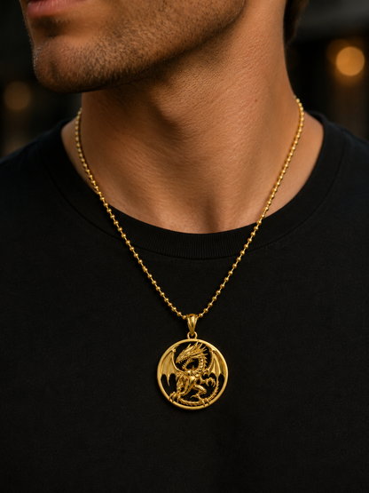 A close-up of a man wearing a gold chain necklace with a circular pendant featuring a detailed dragon design, styled with a black t-shirt.