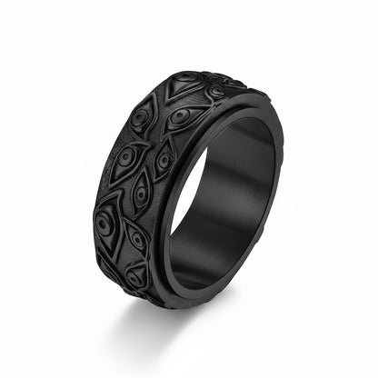 Black metal ring with intricate design on a white background