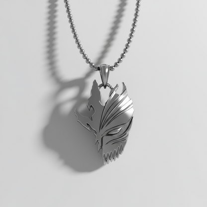 Silver wolf head pendant on a chain against a light gray background