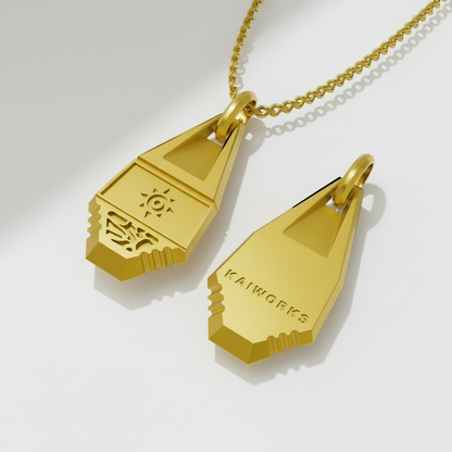 Gold pendant with 'Kaiworks' branding on a white background