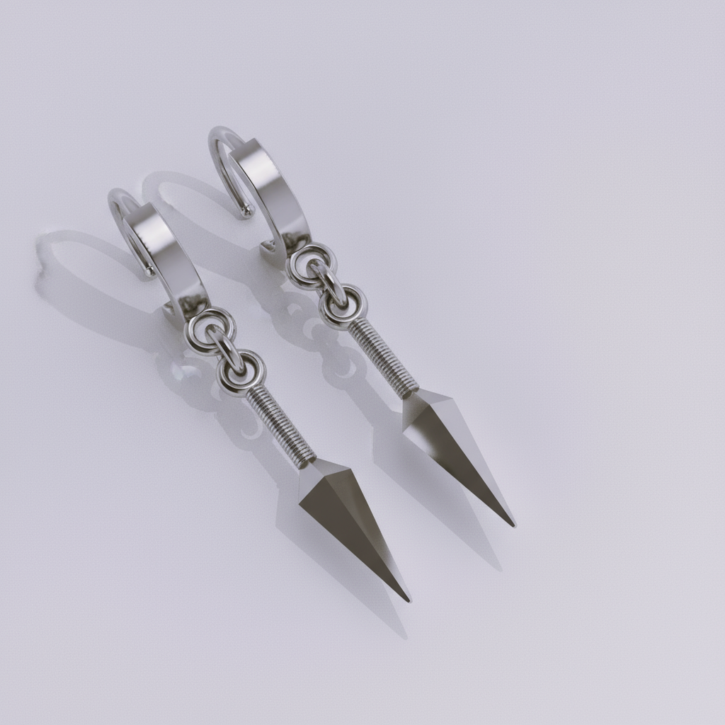 A pair of 14K gold kunai earrings with a polished silver and 18K yellow gold plating, displayed on a wooden surface with a plant in the background.