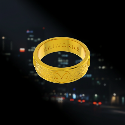 Gold ring with 'KAIWORKS' branding on a white background