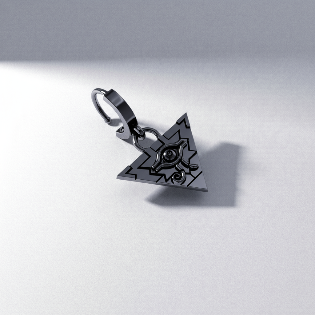 A gold-colored earring with a geometric design displayed against an out-of-focus background featuring a pyramid.