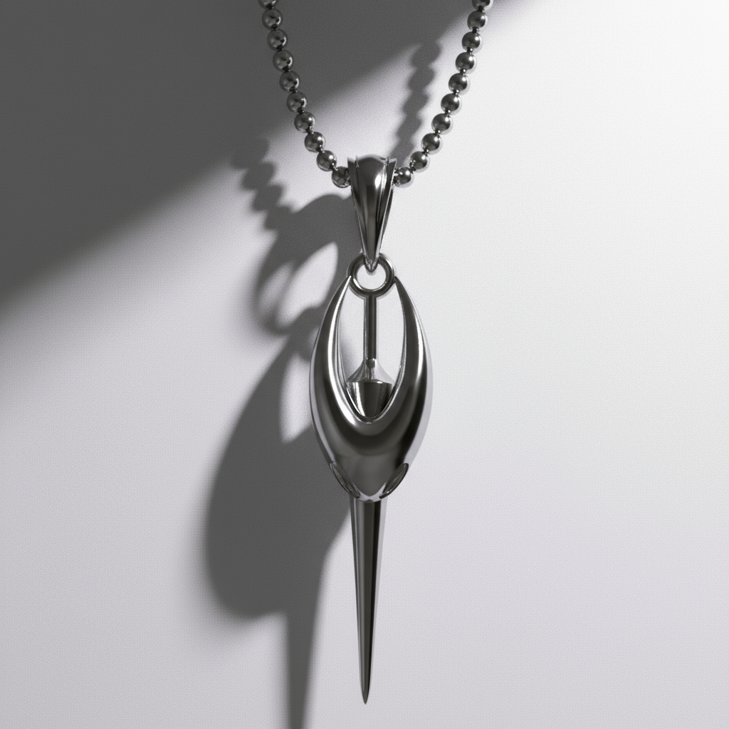 Silver spoon-shaped pendant on a chain against a white background