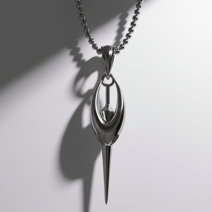 Silver spoon-shaped pendant on a chain against a white background