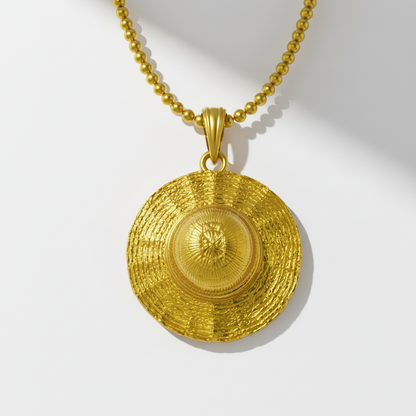Gold pendant necklace on a white background