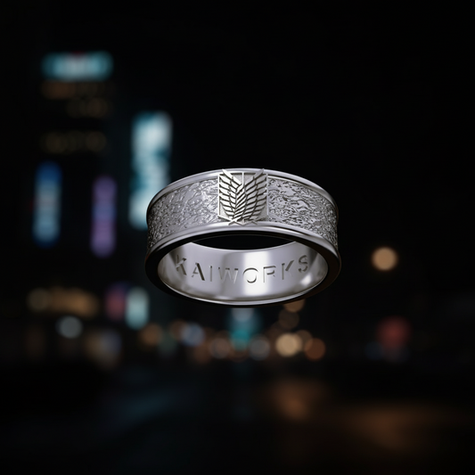 Silver ring with intricate design on a white background