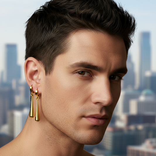 Man wearing gold earrings with a cityscape background